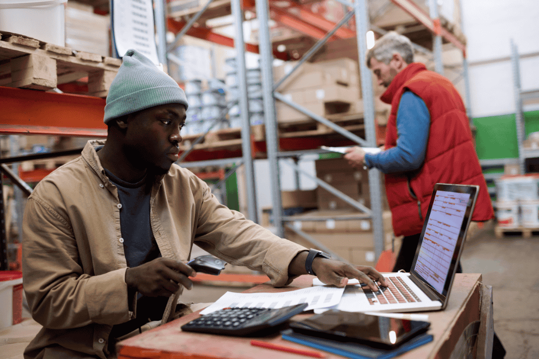 distributor scanning barcodes of parcels in a warehouse